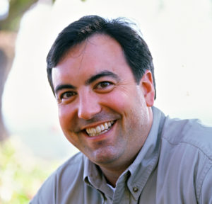 John in a Grey Color Shirt Smiling Portrait One